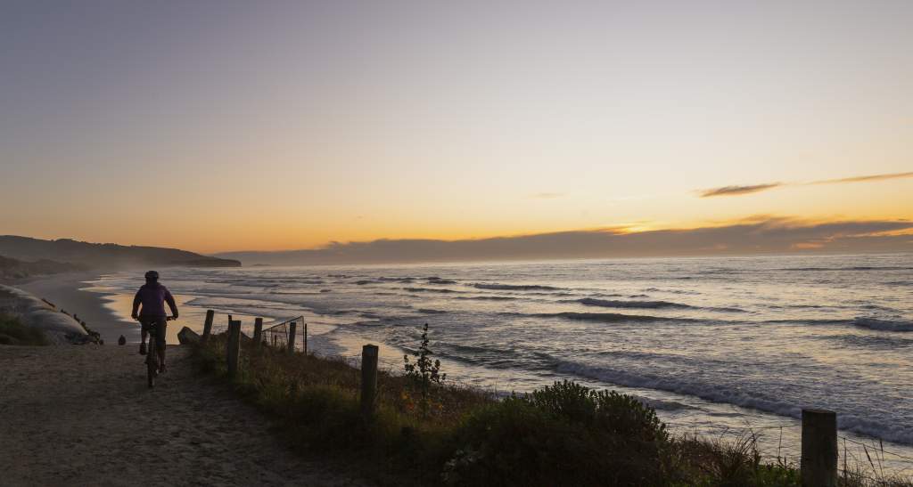 Cyclist at St Clair Beach Sunrise Dunedin credit Geoff Marks 33